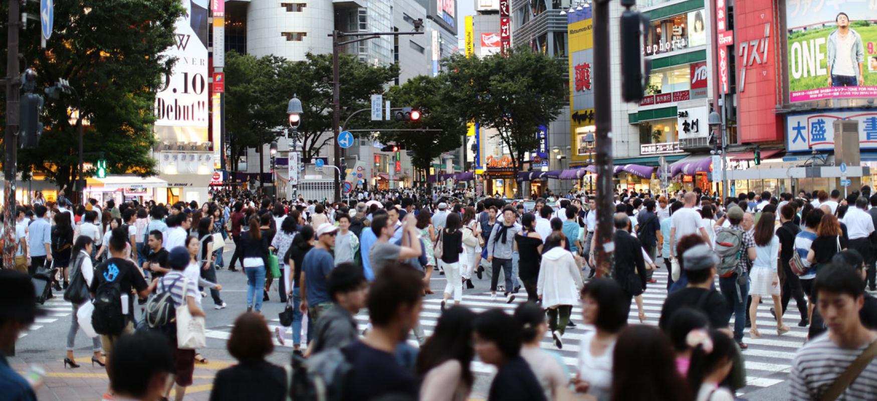 Pedestrians in a busy crossroads in Tokyo.